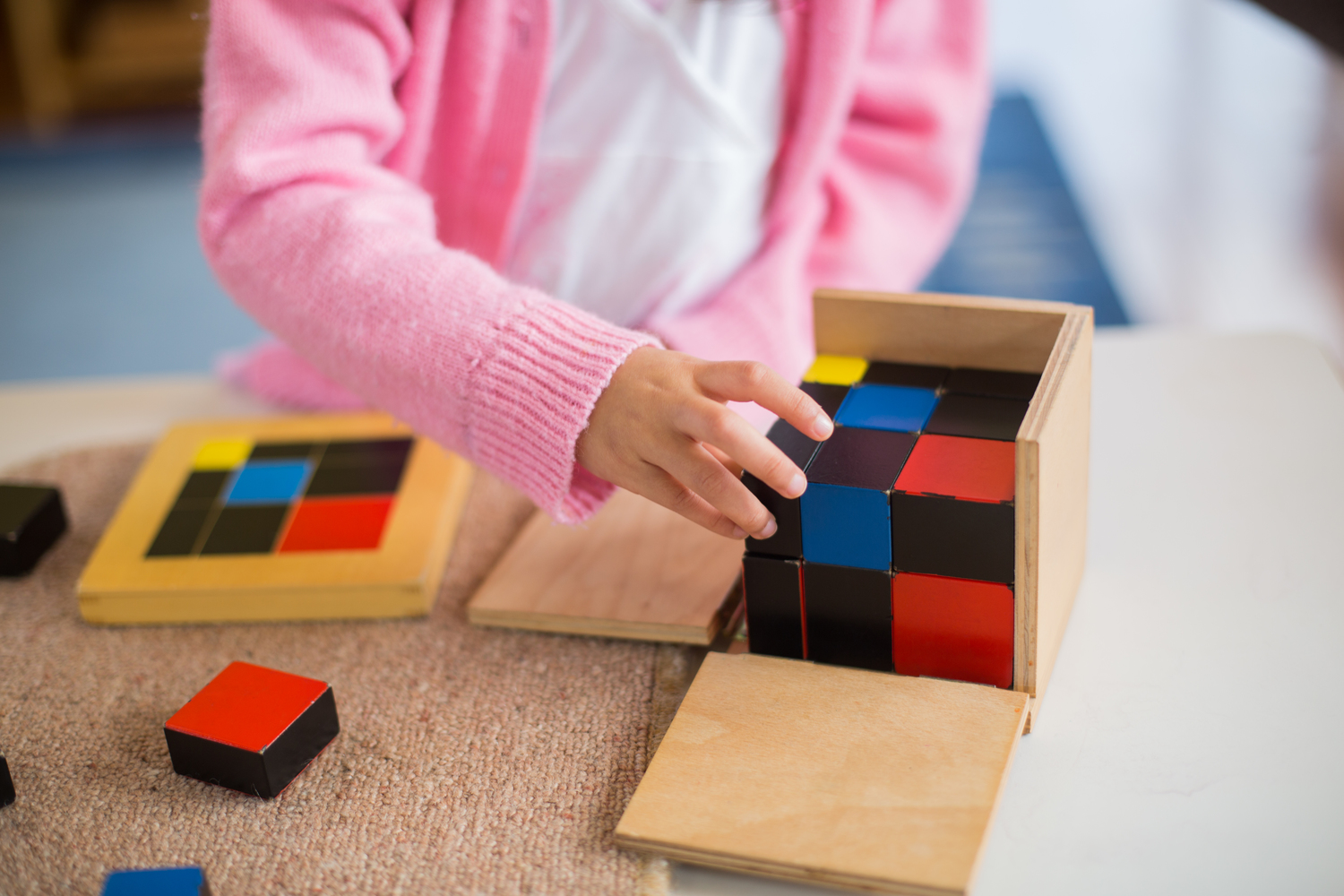 A child at work using montessoir material